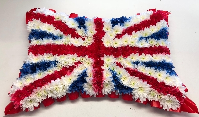 Union Jack funeral tribute made using red, white and blue sprayed chrysanthemum. 