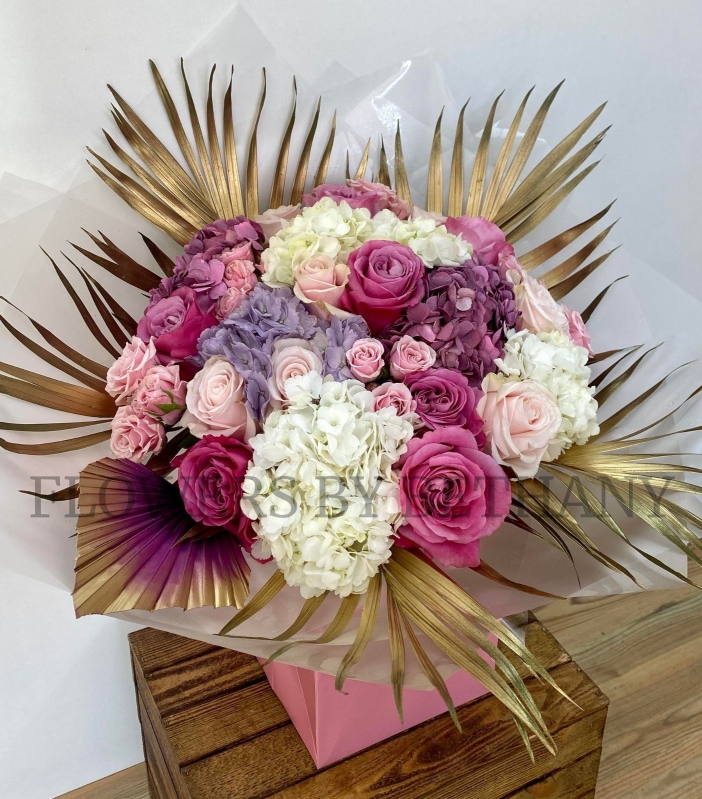 The most dreamy bouquet filled with roses, hydrangea and spray rose in perfect pink and lilac tones. 