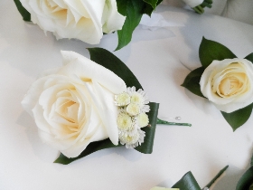 White rose and salal foliage wedding collection including 1 x bridal bouquet, 2 x bridesmaid bouquets and 6 x buttonholes. 